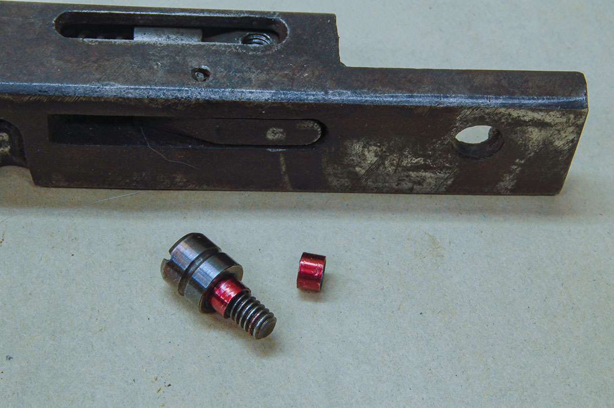 Spacers (colored red for clarity) fit into the cocking knob to prevent rubbing on the breechblock and causing misfires.